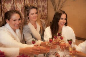 Women toasting with champagne at Salt Cave private event.